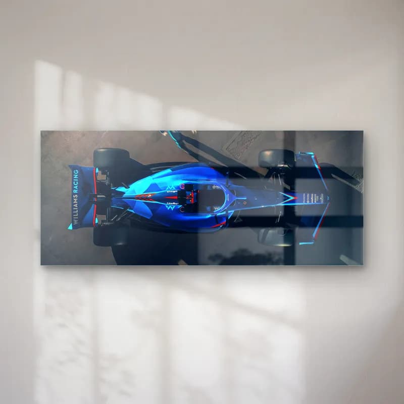 Kuşbakışı Williams F1 Aracı cam tablo — Koyu zeminde yukarıdan görülen parlak mavi Williams F1 aracı